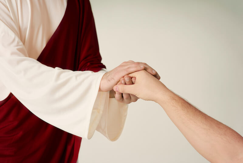 Whom say ye that I am showing an image of Jesus stretching His hand to save someone