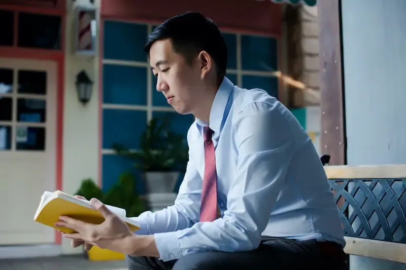 the wisest thing you can ever do is to get wisdom showing an asian man reading