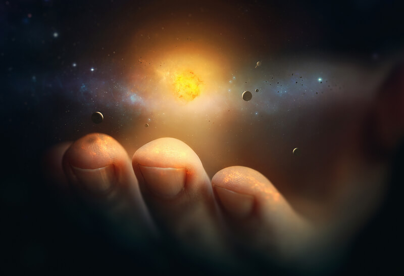 His word are spirit and life showing a hand holding the universe